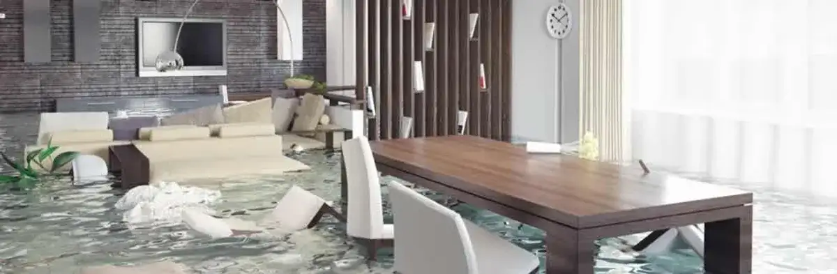 home interior affected by water damage with flooded floors and displaced furniture in Jersey City, NJ